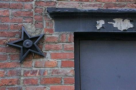 meaning of metal stars on houses|cast iron stars on buildings.